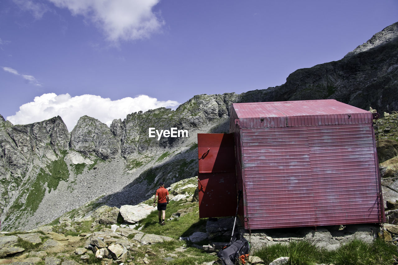 Rear view of man walking on mountain