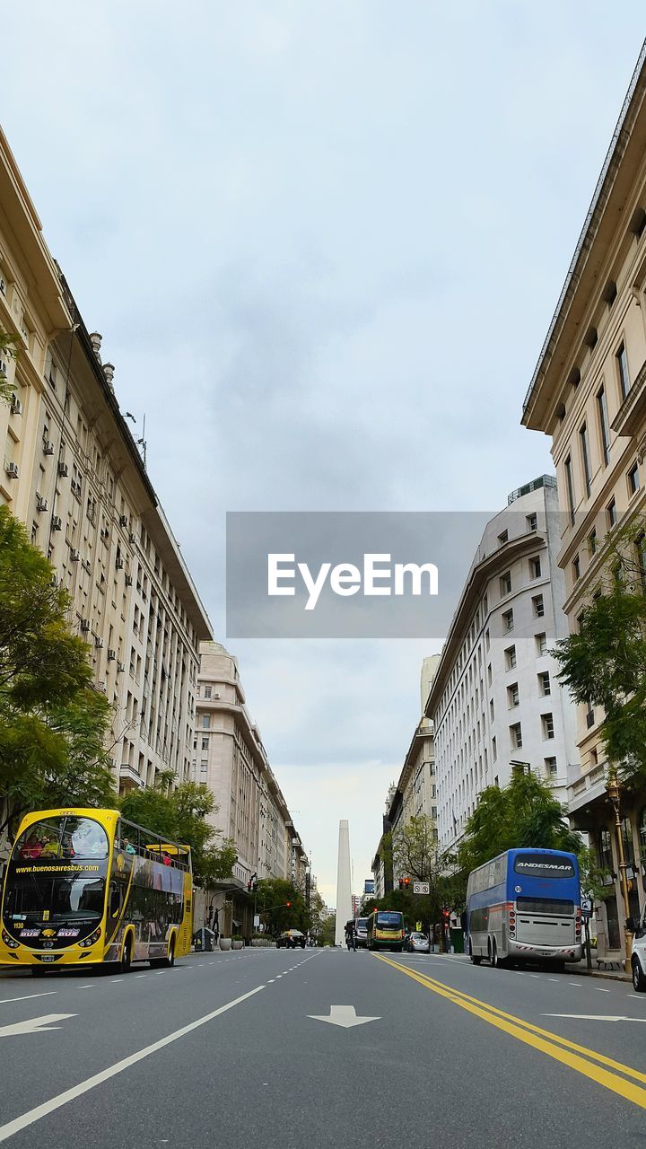 VIEW OF CITY STREET AGAINST SKY