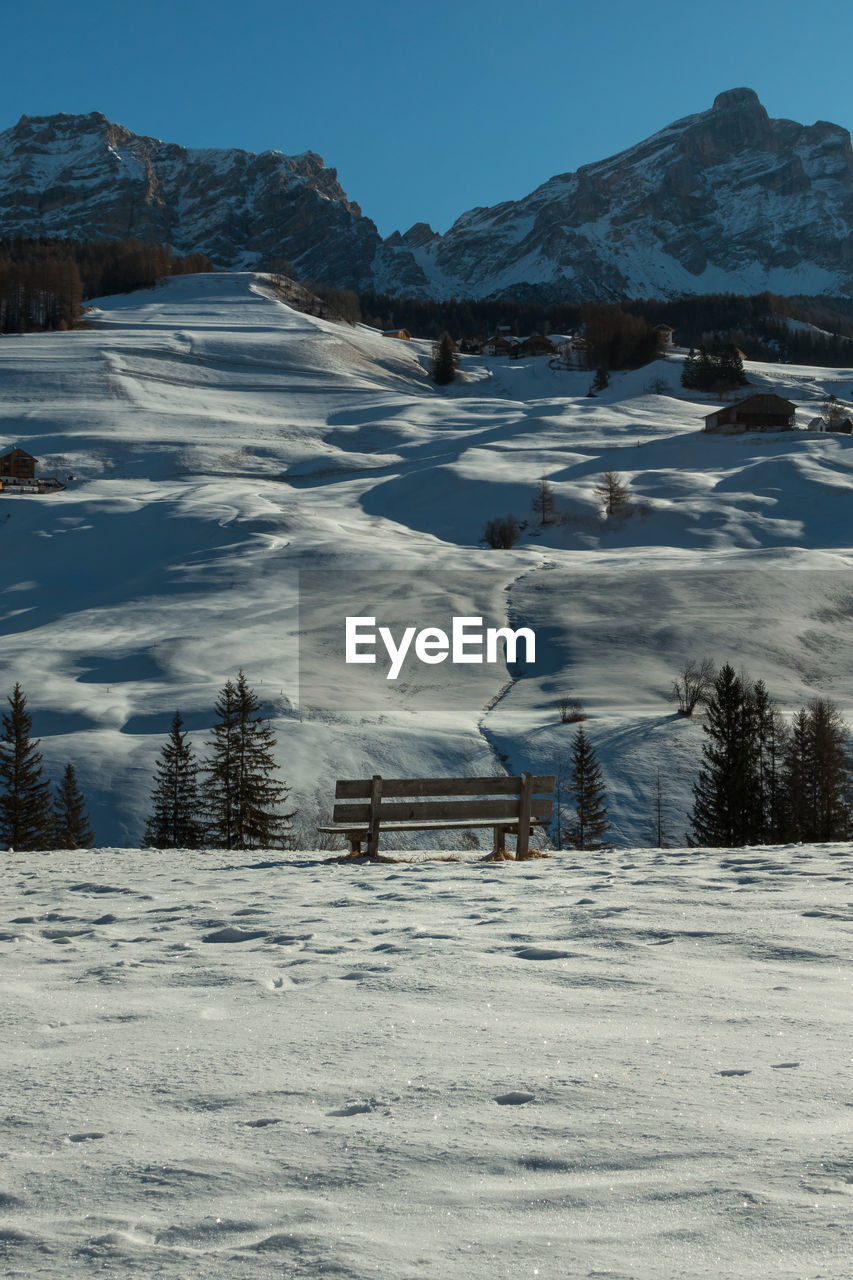 SNOW COVERED MOUNTAIN AGAINST SKY