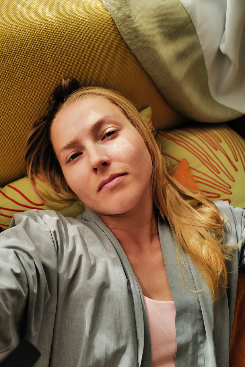 Woman relaxing on the colorful pillows