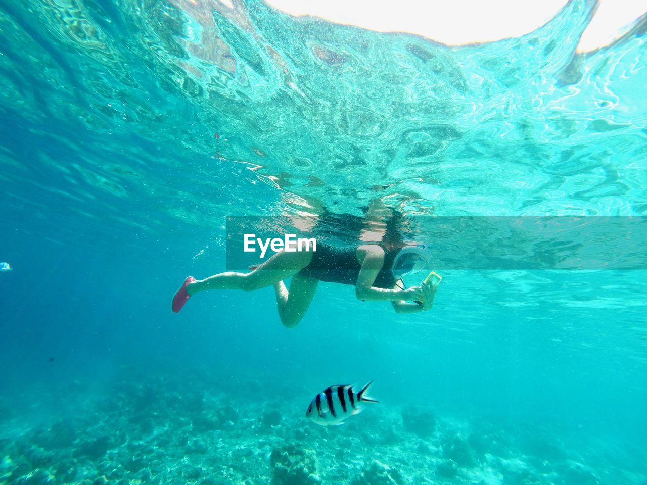 Woman swimming in sea