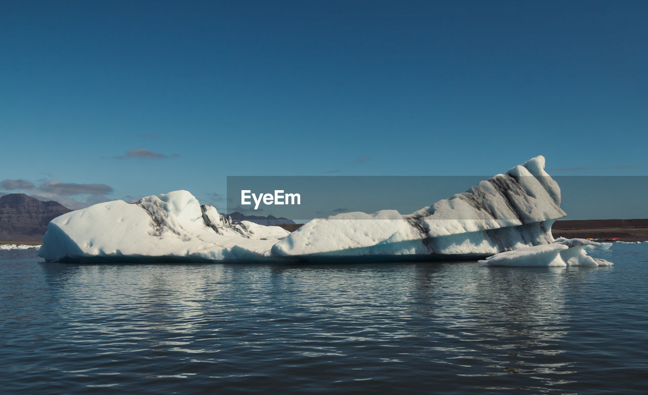 Huge glacier in calm northern sea landscape photo