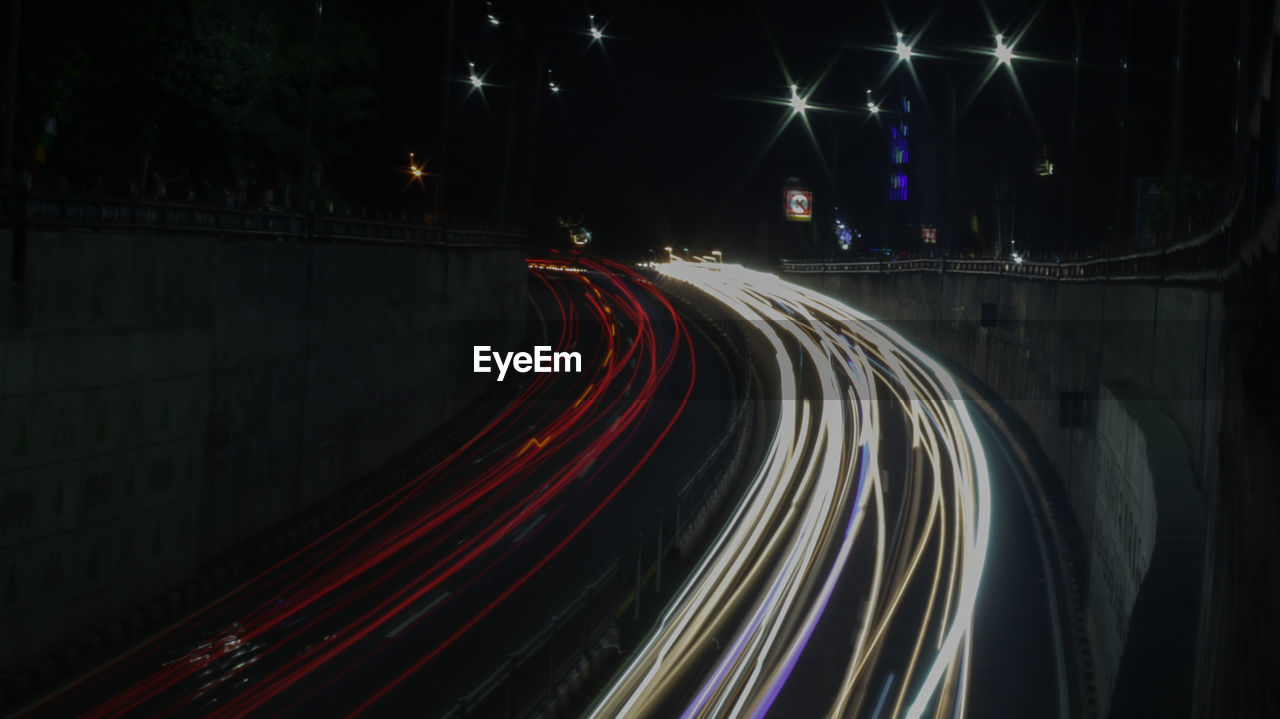 High angle view of light trails on road at night