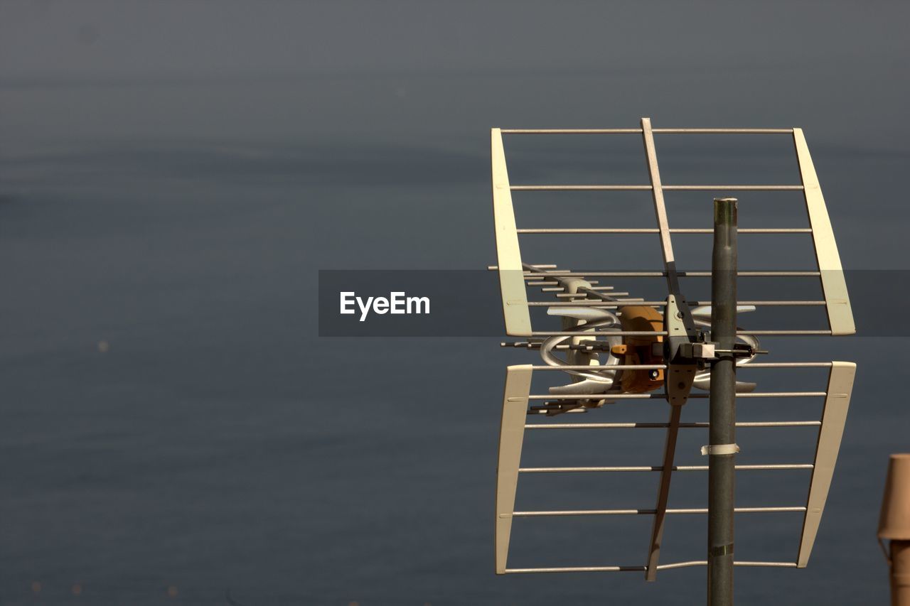 Television aerial against sea
