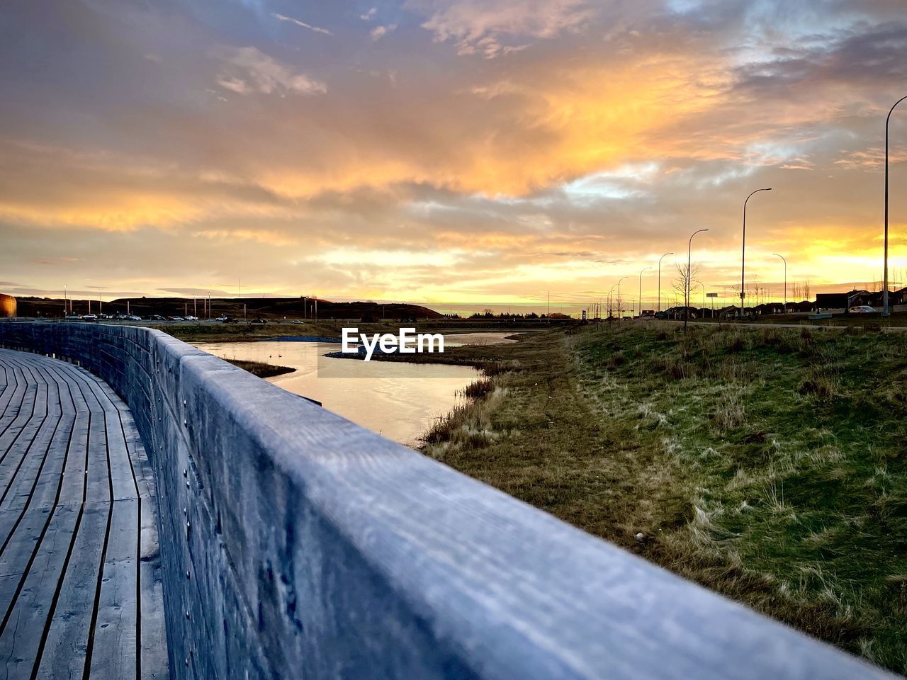 sky, morning, cloud, sunlight, horizon, environment, sea, sunrise, nature, dusk, coast, reflection, landscape, water, beauty in nature, shore, scenics - nature, land, ocean, wave, no people, dramatic sky, tranquility, transportation, outdoors, plant, sun, environmental conservation, road, tranquil scene, grass, rural scene, power generation, travel, footpath, architecture, travel destinations, non-urban scene, wood