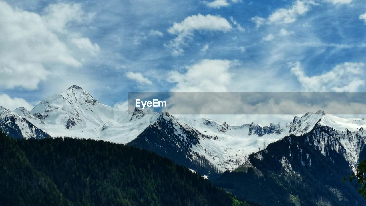 Scenic view of snowcapped mountains against sky