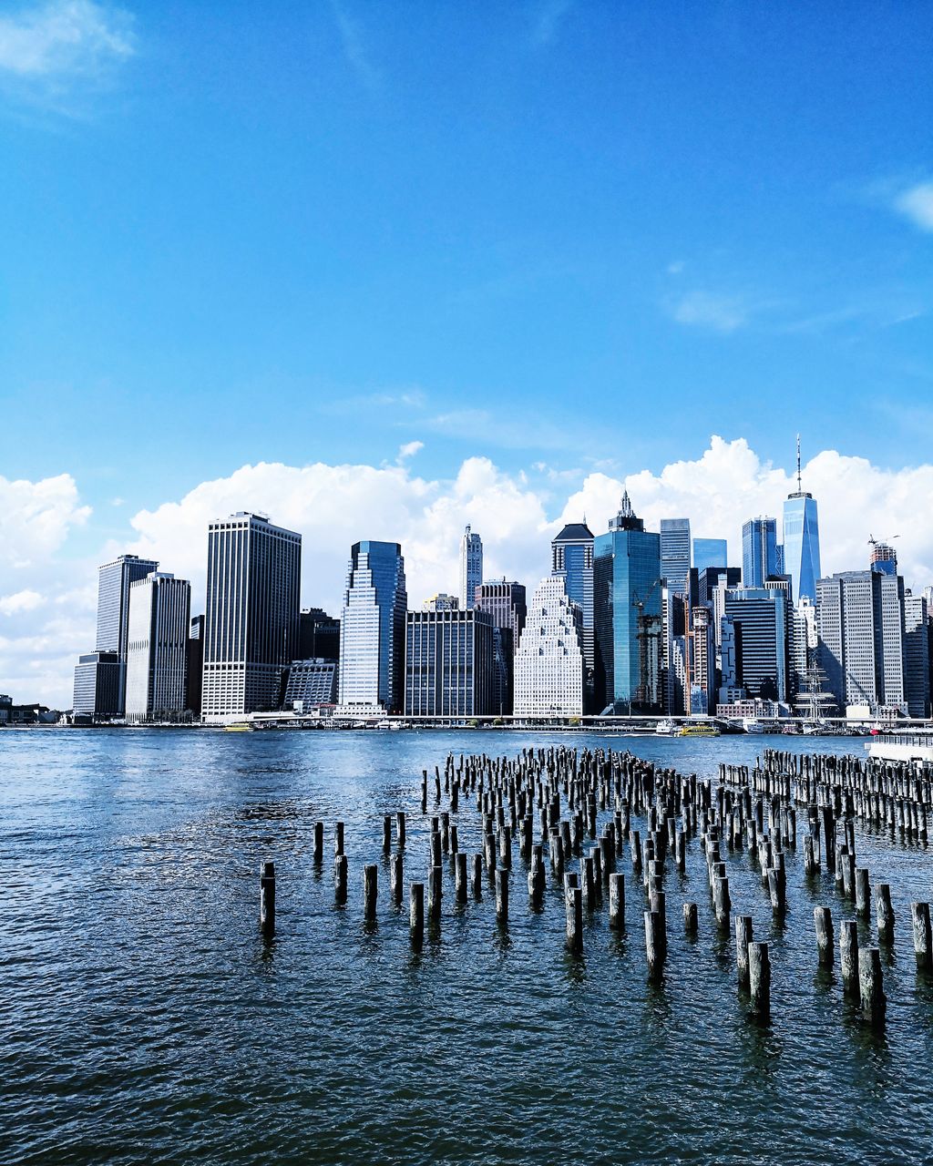 VIEW OF SEA AGAINST CITYSCAPE