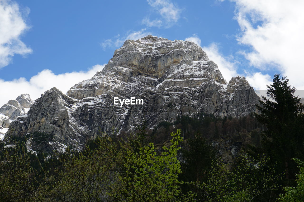 Low angle view of rock formations against sky