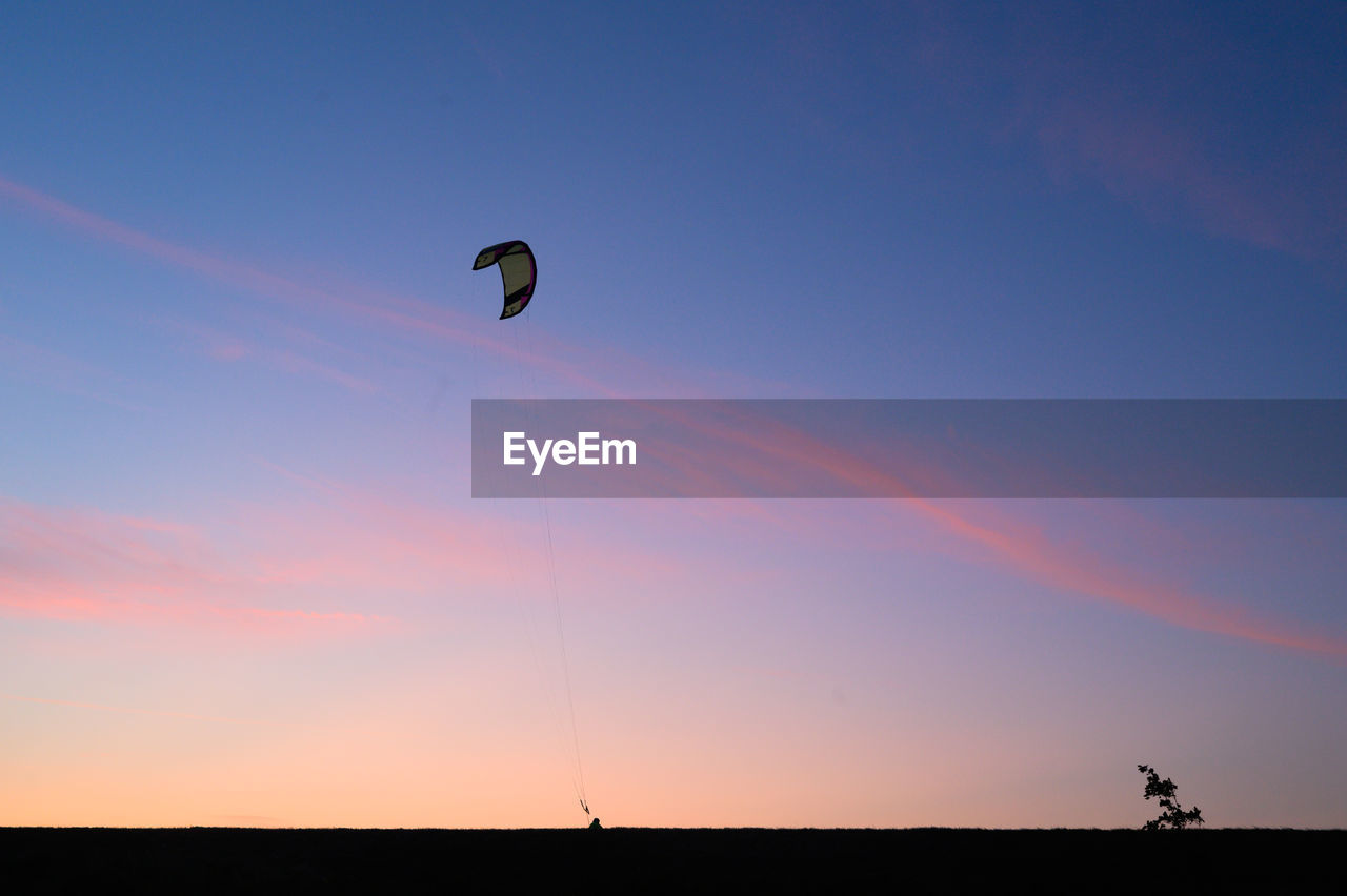 Kite in the sunset sky
