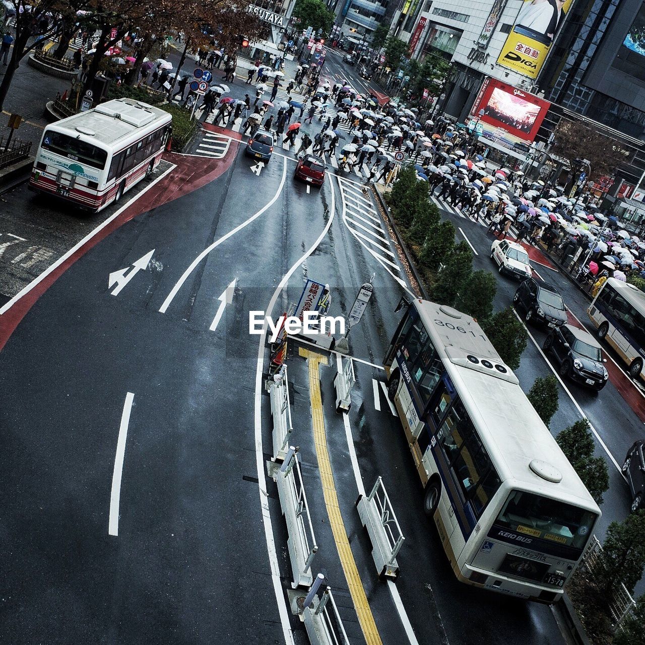 High angle view of people and vehicles on street