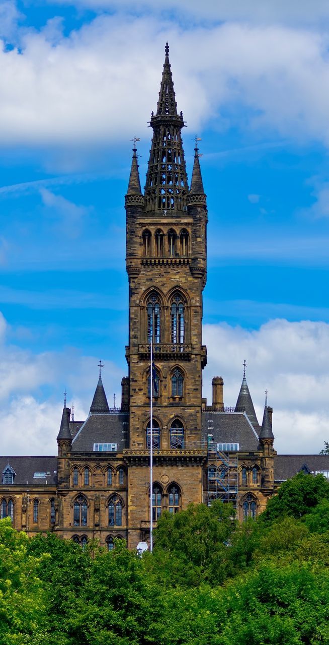 VIEW OF BUILT STRUCTURE AGAINST CLOUDY SKY