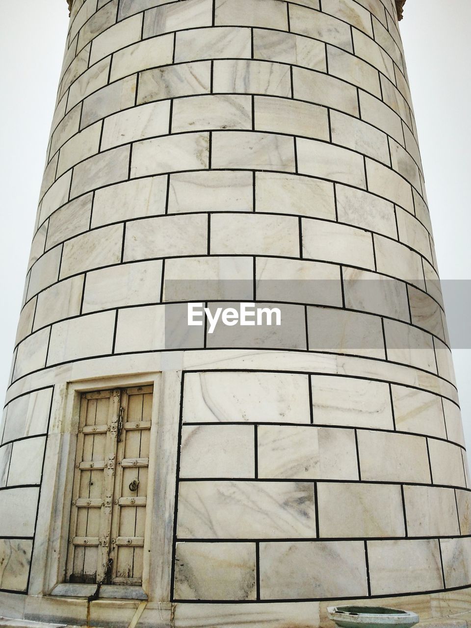 LOW ANGLE VIEW OF BUILDING WITH BUILT STRUCTURE