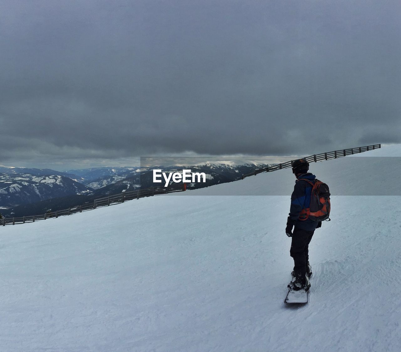 Man standing on snow covered landscape