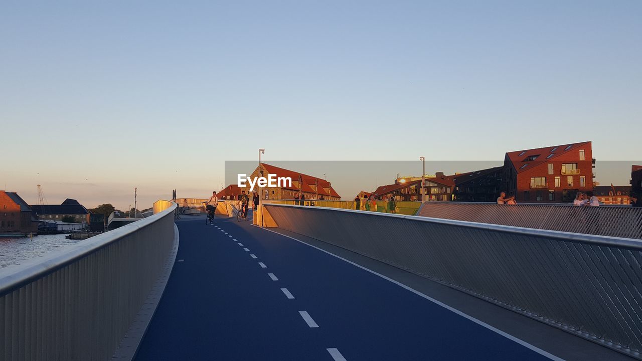 View of bridge in city against clear sky