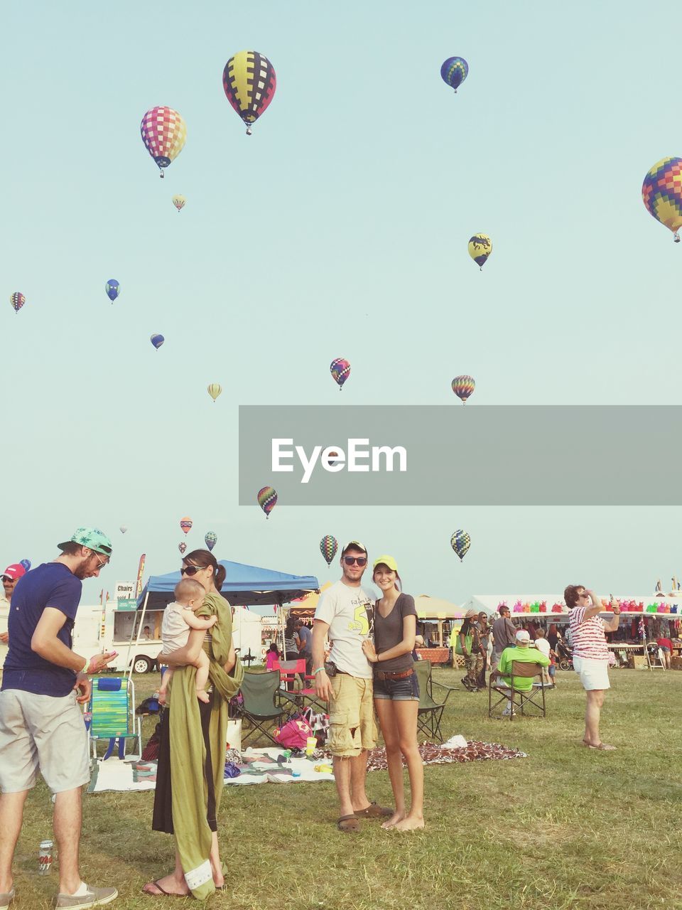 GROUP OF PEOPLE WATCHING BALLOONS