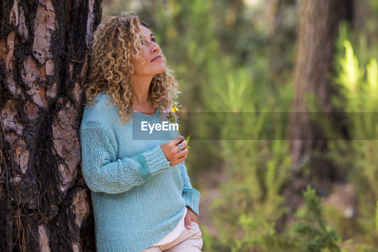 Side view of woman in tree