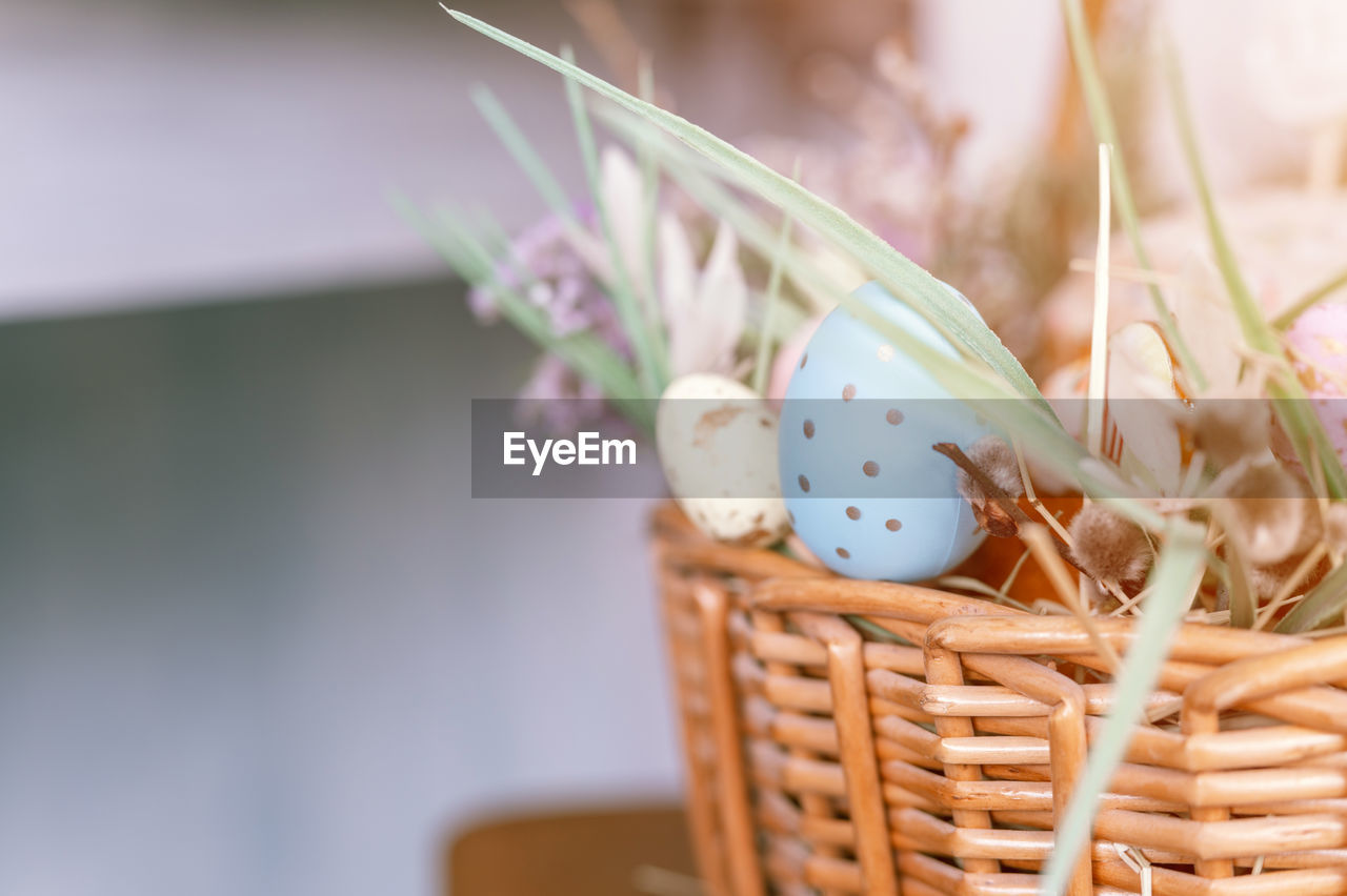 basket, wicker, container, easter, food, egg, celebration, plant, food and drink, nature, easter egg, picnic basket, flower, no people, tradition, flowering plant, freshness, springtime, holiday, close-up, decoration, hamper, gift basket, selective focus, focus on foreground, outdoors, event, beauty in nature, still life