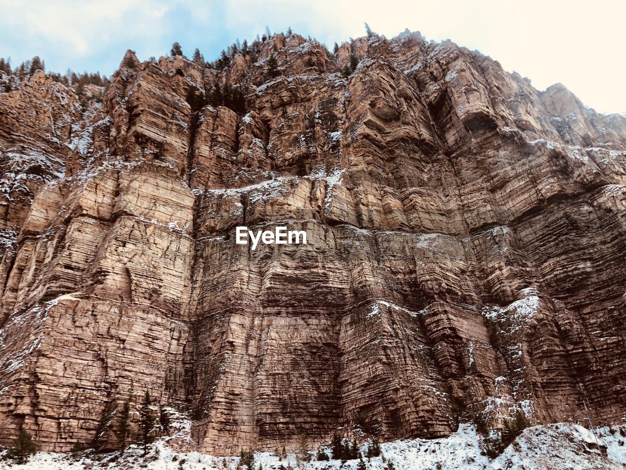 Low angle view of rock formations against sky