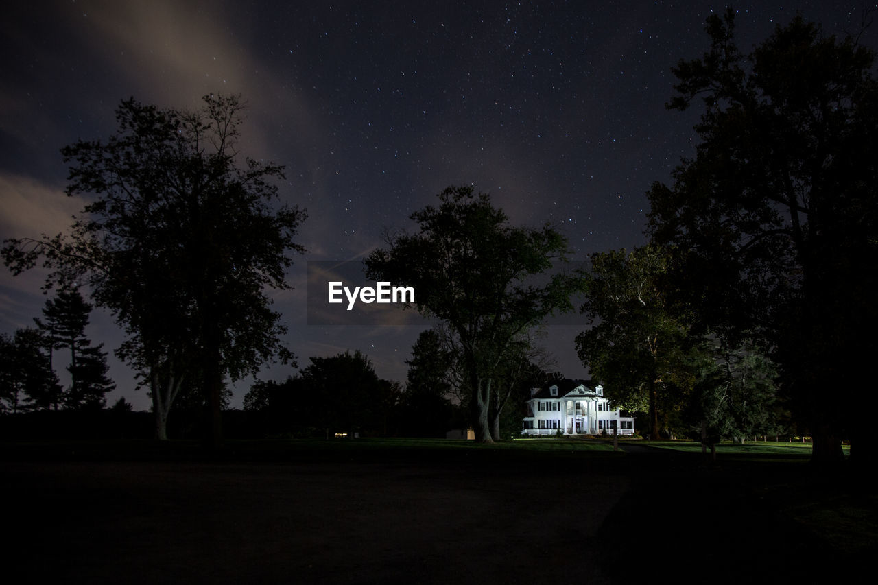 SILHOUETTE TREES BY LANDSCAPE AGAINST SKY AT NIGHT