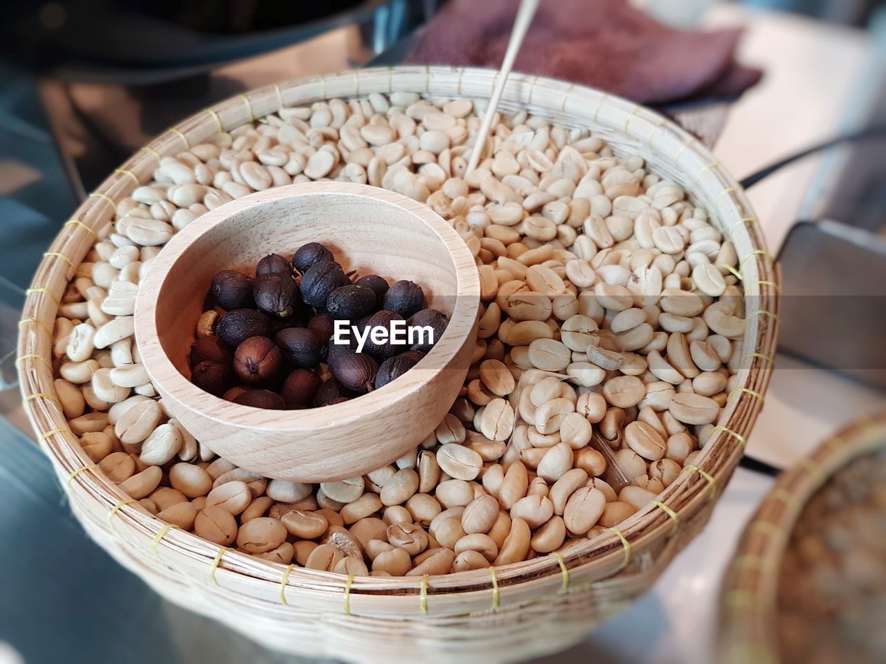 High angle view of coffee beans in bowl on table