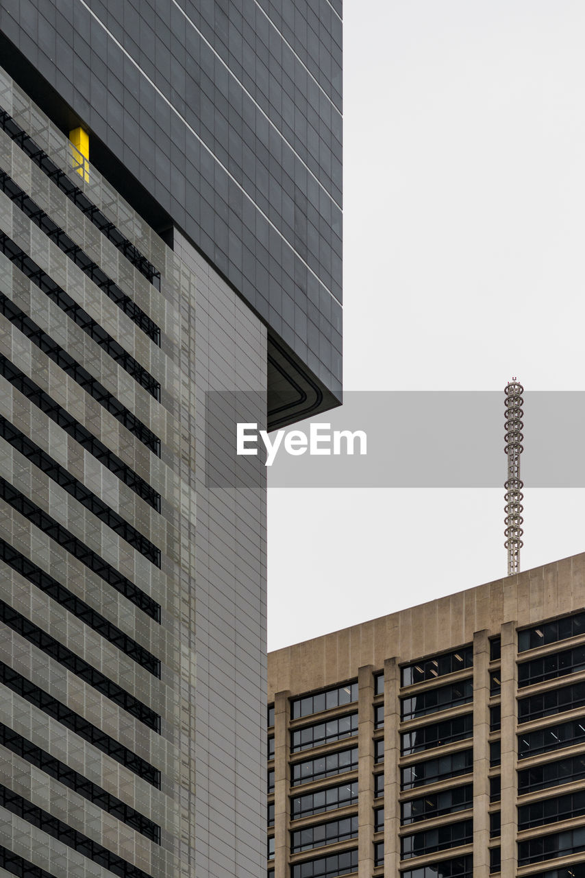 Low angle view of modern buildings against clear sky