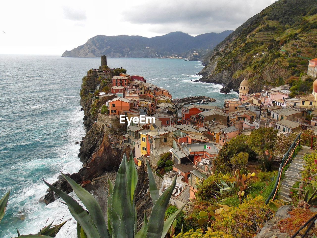 Scenic view of sea and mountains against sky