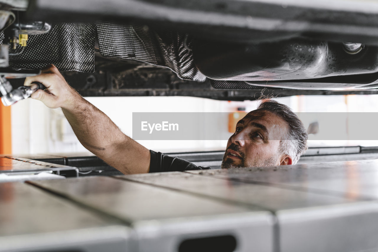 Man repairing car