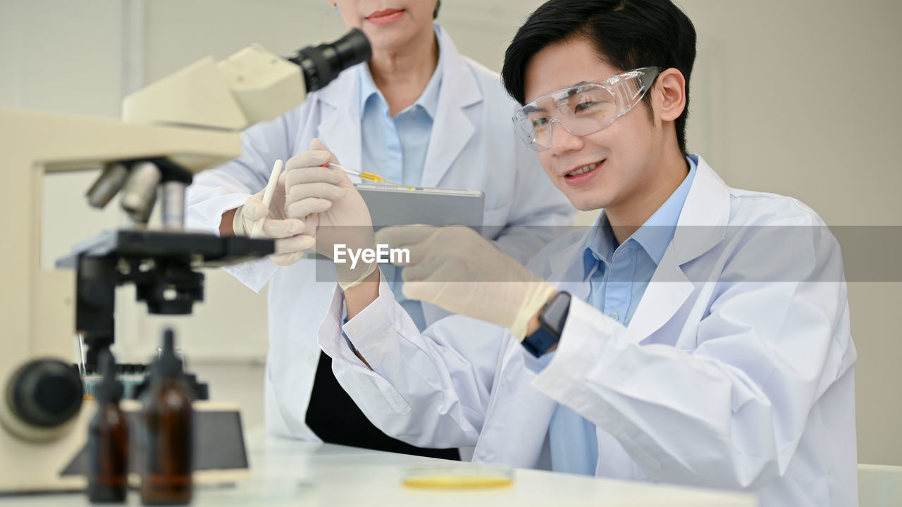 female doctor examining patient in clinic