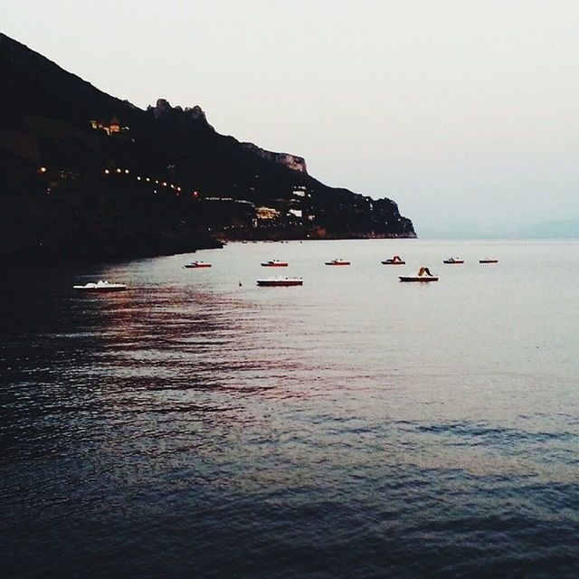 VIEW OF BOATS IN SEA