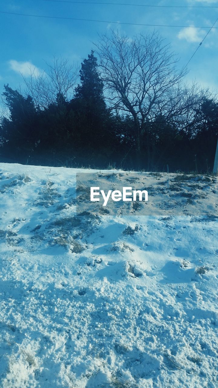 VIEW OF SNOW COVERED LANDSCAPE