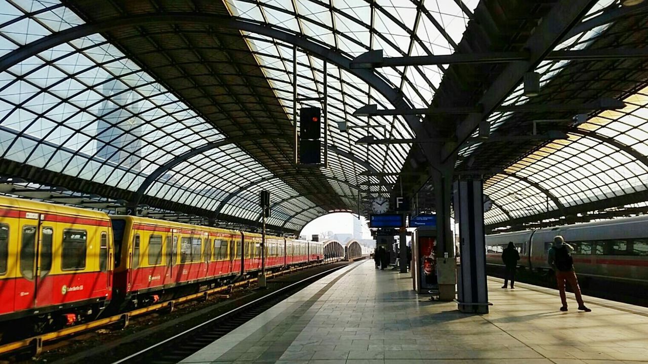 TRAIN ON RAILROAD STATION PLATFORM