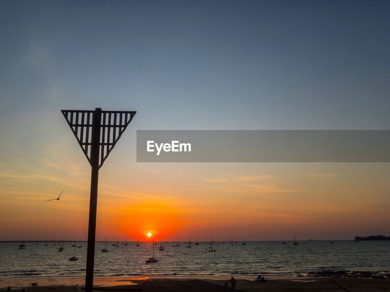 SCENIC VIEW OF SUNSET OVER SEA