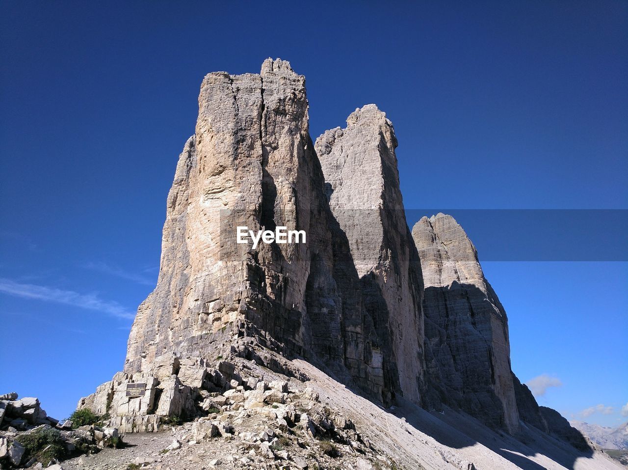 Low angle view of rock formation against blue sky