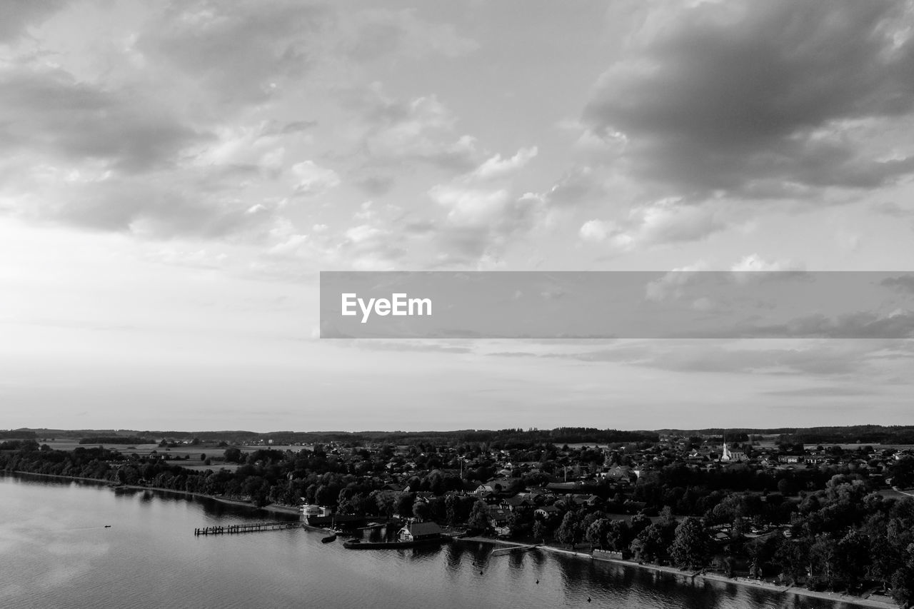 sky, water, cloud, black and white, horizon, monochrome photography, nature, scenics - nature, monochrome, beauty in nature, environment, tranquility, sea, no people, landscape, tranquil scene, reflection, outdoors, day, shore, land, coast, architecture, travel destinations, non-urban scene, horizon over water