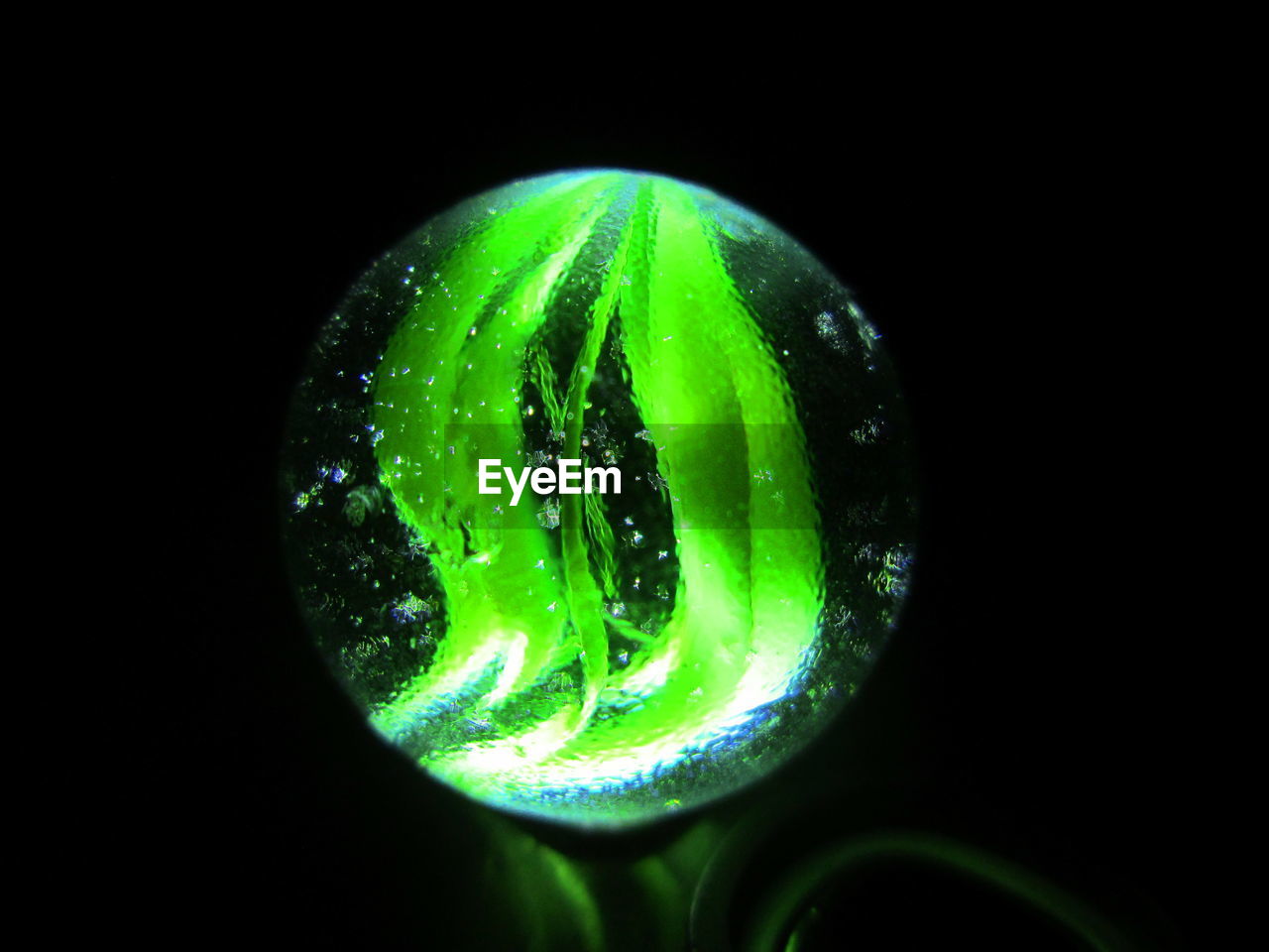 CLOSE-UP OF WATER OVER BLACK BACKGROUND