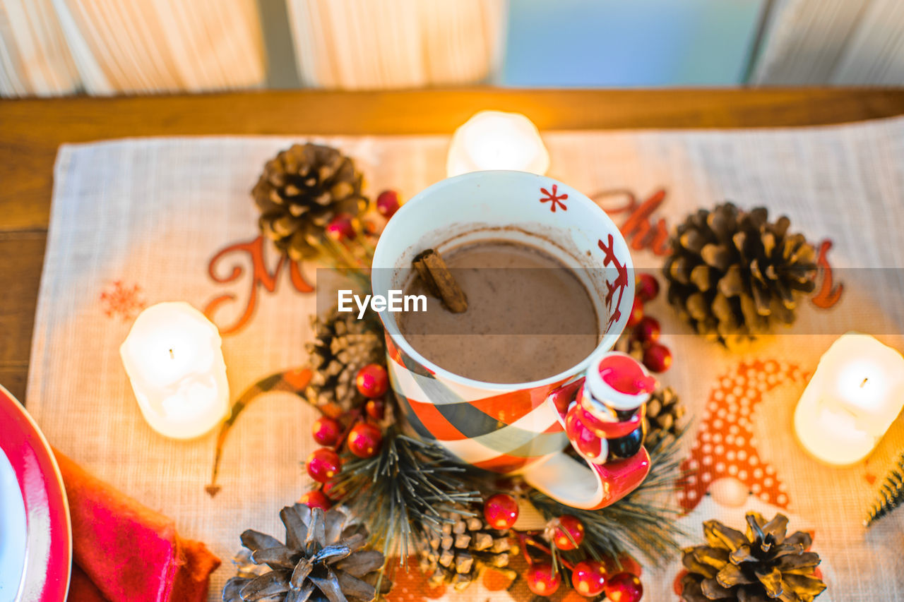 food and drink, cup, drink, mug, food, table, hot drink, indoors, refreshment, no people, wood, plant, crockery, coffee, tea, christmas, decoration, tradition, holiday, nature, still life, celebration, coffee cup, high angle view, healthy eating, freshness, flower, spice, meal, tea cup, tree, christmas decoration, wellbeing, saucer