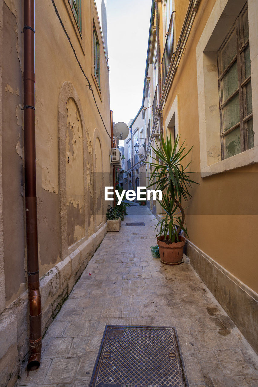 Typical small street on the island of ortigia, syracuse in sicily, italy