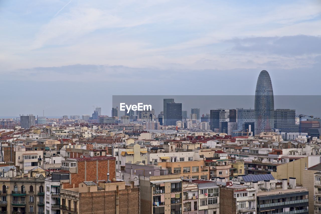 Buildings in city against sky