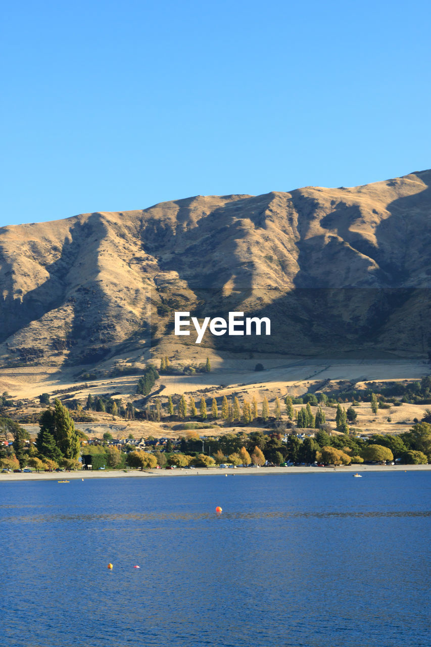 SCENIC VIEW OF MOUNTAINS AGAINST BLUE SKY