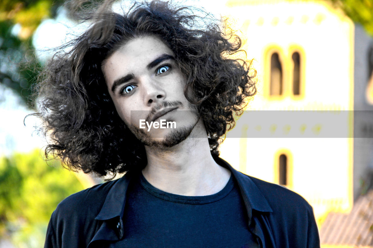 CLOSE-UP PORTRAIT OF YOUNG MAN WITH EYES CLOSED