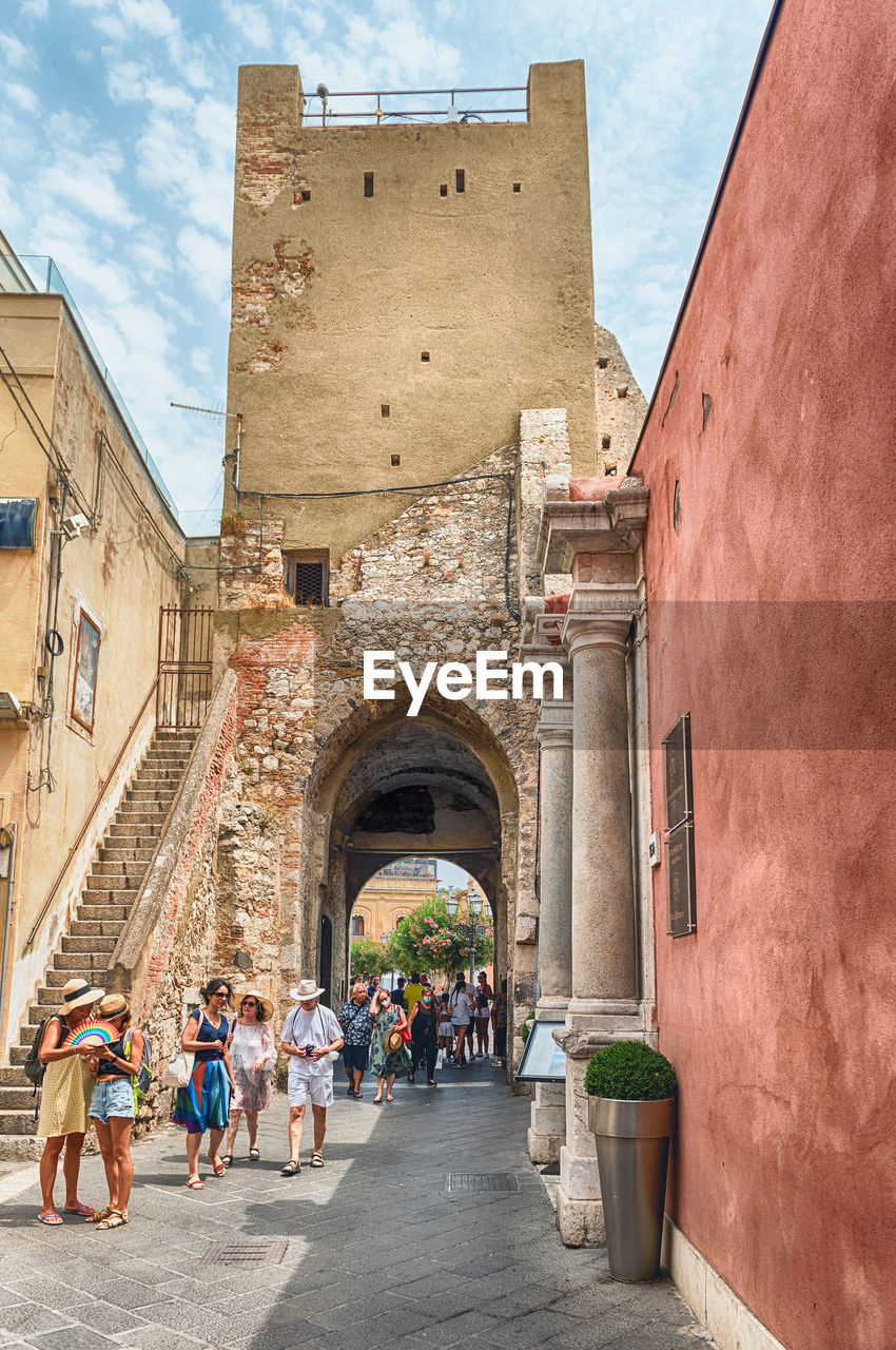 Walking in the picturesque streets of taormina, sicily, italy