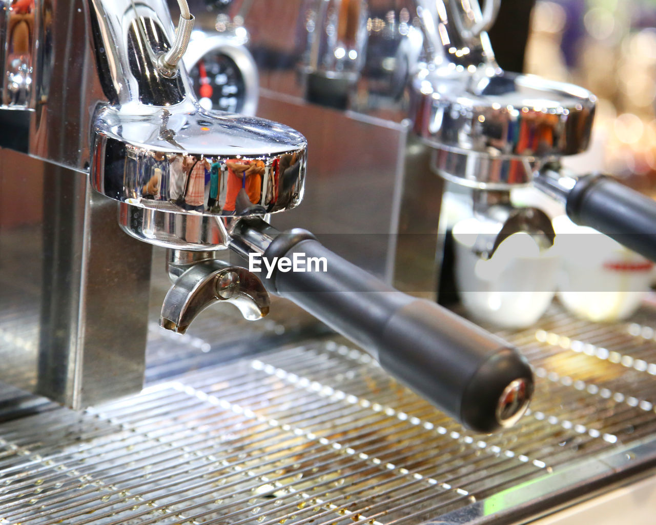 CLOSE-UP OF COFFEE CUP ON TABLE IN CAFE