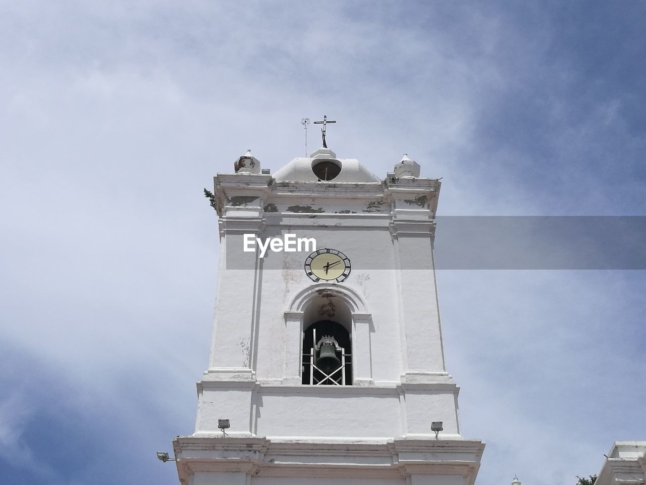 Low angle view of bell tower against sky