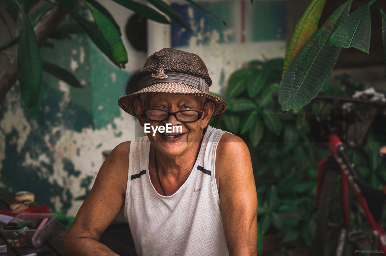 Portrait of smiling man wearing hat