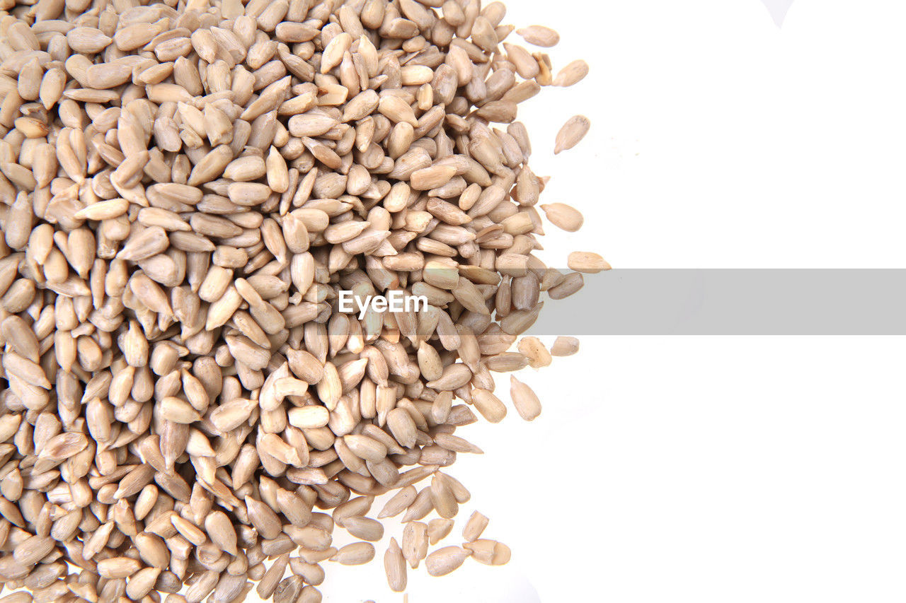 food and drink, food, whole grain, white background, seed, healthy eating, wellbeing, cereal plant, large group of objects, agriculture, cut out, wheat, food grain, raw food, plant, emmer, sunflower seed, produce, freshness, studio shot, crop, heap, abundance, cereal, nature, barley, indoors, no people, organic, backgrounds, whole wheat, oats - food, brown, close-up