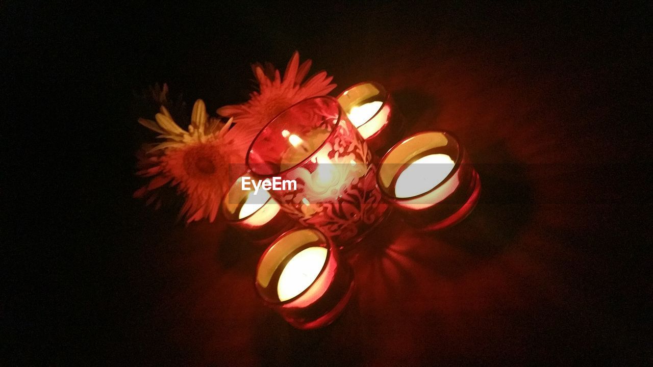 CLOSE-UP OF ILLUMINATED LIGHT BULB