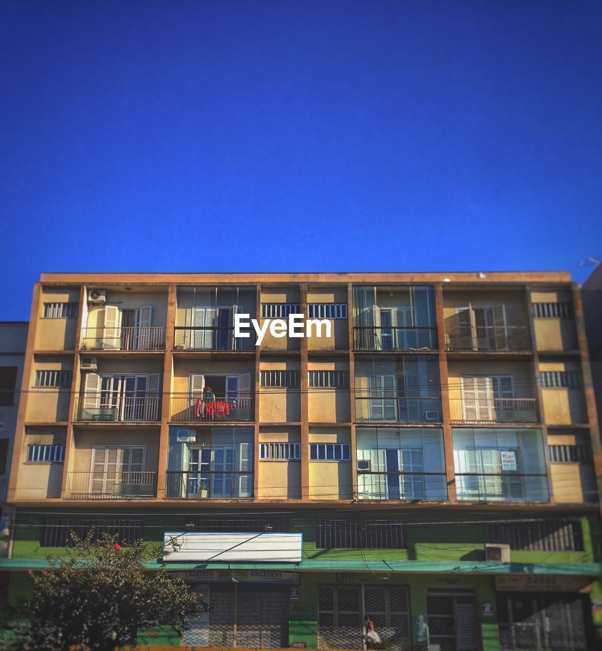 Low angle view of building against clear blue sky