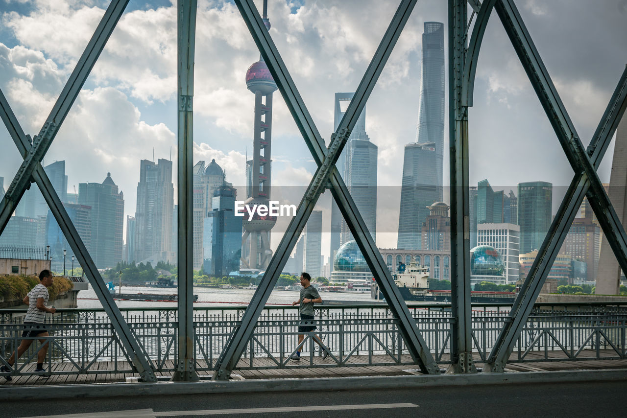 VIEW OF SUSPENSION BRIDGE IN CITY