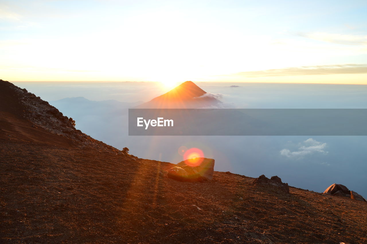 Scenic view of landscape against sky during sunset