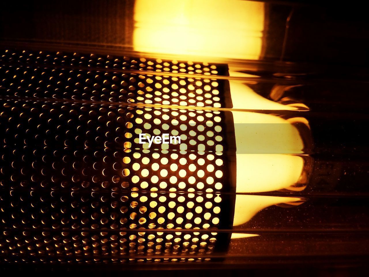 CLOSE-UP OF ILLUMINATED LIGHT